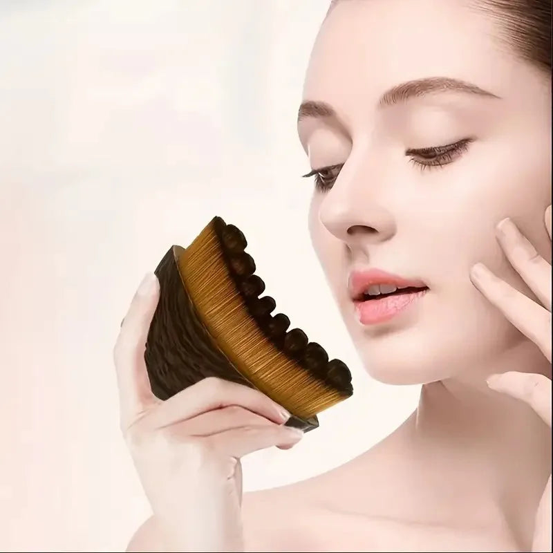 Portable dry facial brush with soft bristles for lymphatic massage, face sculpting, and gentle exfoliation at home spa.