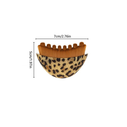 Portable dry facial brush with soft bristles and contoured design for lymphatic massage, exfoliation, and face sculpting at home.