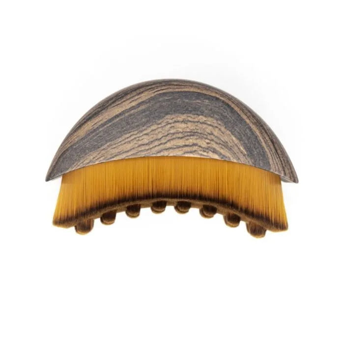 Portable dry facial brush with soft bristles for lymphatic massage and gentle exfoliation, ideal for face sculpting and home spa use